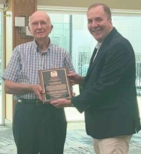 Edward Hosken, Jr, receives the J.O. Sentell Award from NCACC President Gregory Hilton